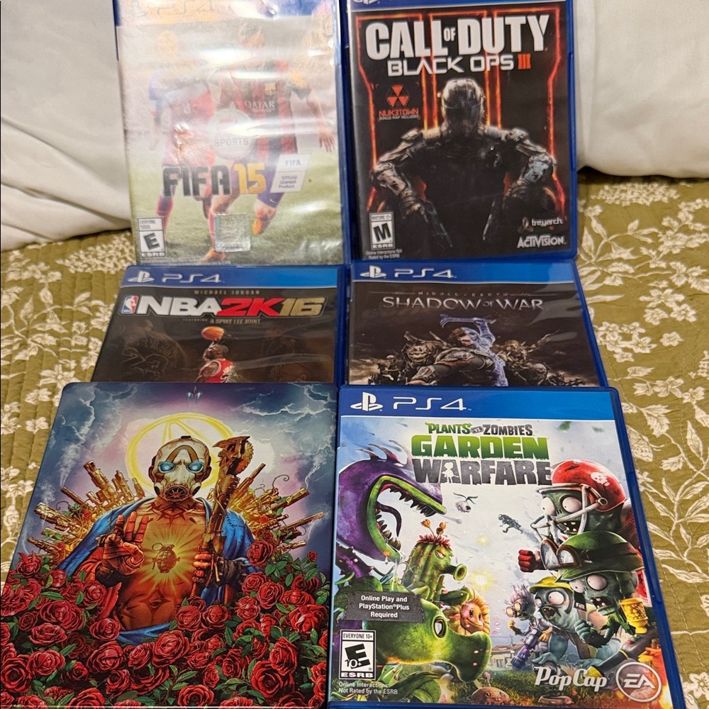 Sony PS4 Game Bundle with Blue Cases and Colorful Artwork